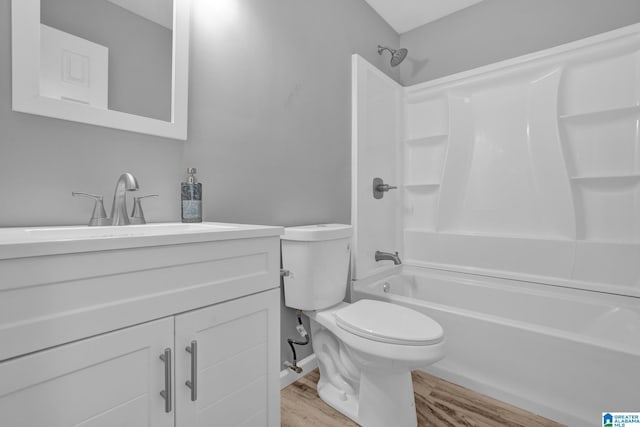 full bathroom with shower / tub combination, hardwood / wood-style floors, vanity, and toilet