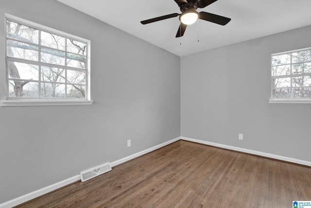 unfurnished room with hardwood / wood-style floors