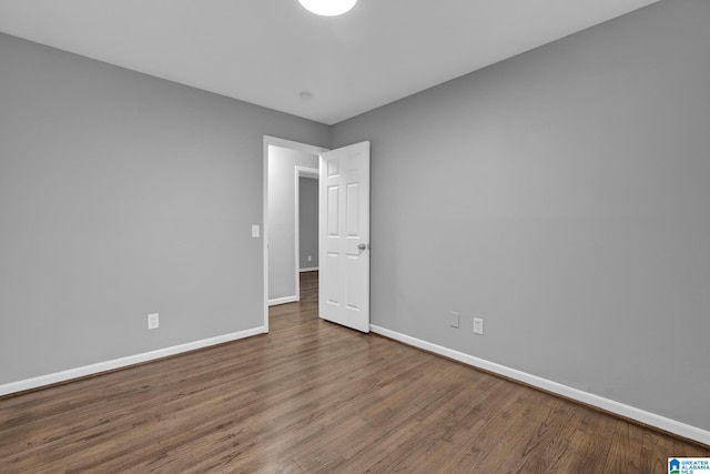 empty room featuring hardwood / wood-style flooring