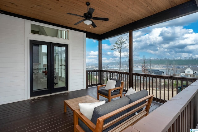 deck featuring ceiling fan, french doors, and an outdoor hangout area