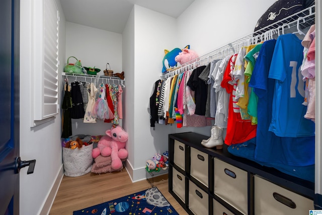 walk in closet featuring light wood-style floors