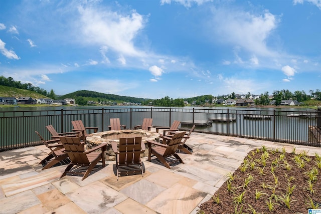 view of patio / terrace featuring a fire pit and a water view