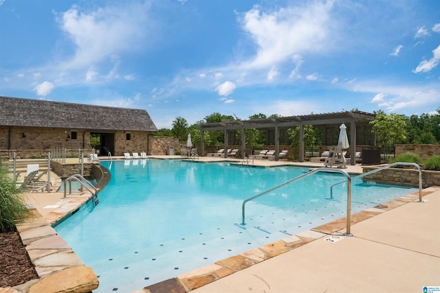 pool featuring a patio and a pergola