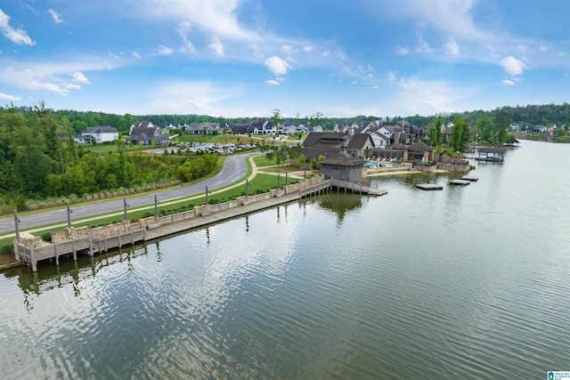 birds eye view of property featuring a water view and a residential view