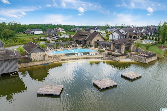 bird's eye view with a water view and a residential view