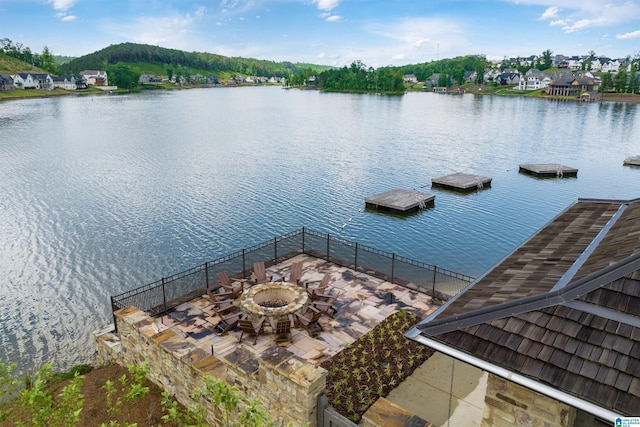 view of water feature with a fire pit