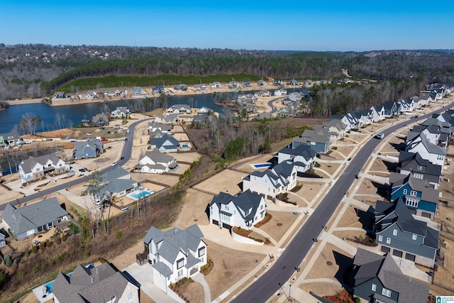 drone / aerial view featuring a water view and a residential view