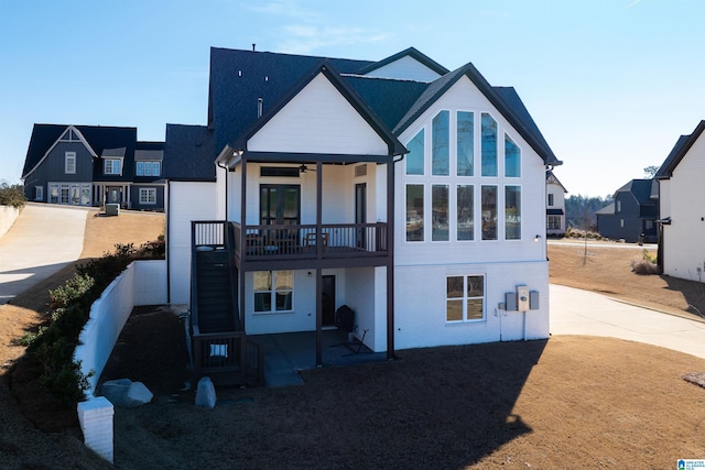 rear view of property featuring brick siding and a residential view