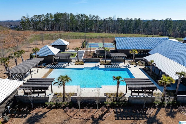 view of pool featuring a fenced in pool and a pergola