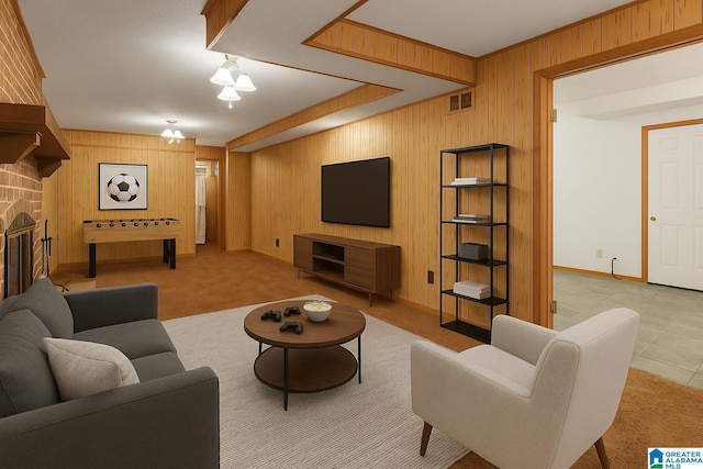 810 Tuscumbia Dr, Birmingham, AL 35214 - carpeted living area with wood walls, baseboards, and a stone fireplace