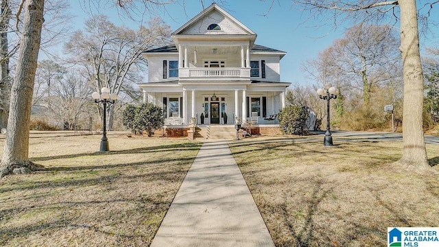 view of front of property with a front lawn and a porch