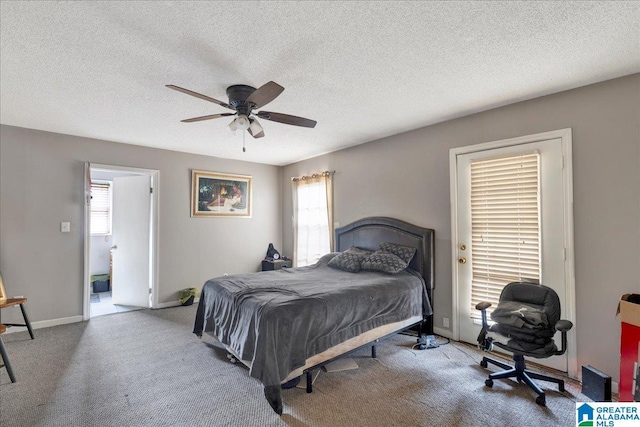 bedroom with ceiling fan, a textured ceiling, and carpet flooring