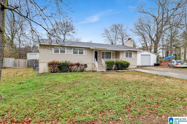 single story home featuring a garage, an outdoor structure, a front lawn, and central air condition unit