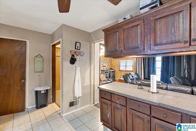 kitchen featuring light tile patterned flooring and ceiling fan