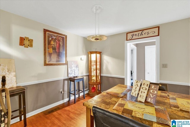 dining space featuring hardwood / wood-style flooring