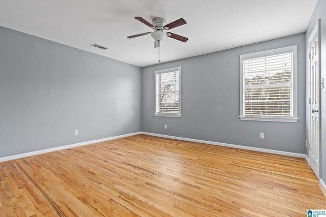 spare room featuring light hardwood / wood-style flooring and ceiling fan