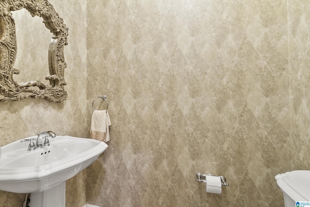 bathroom with sink and toilet