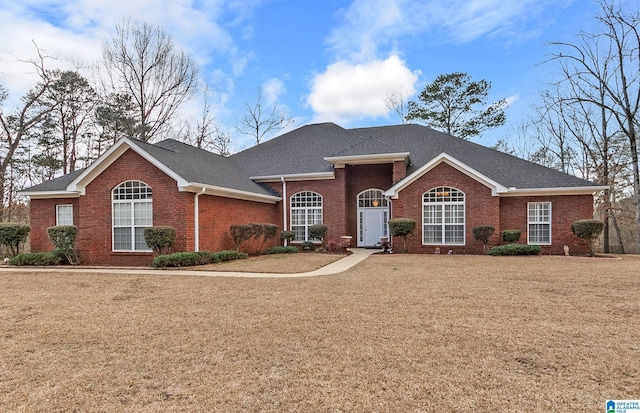 ranch-style house featuring a front lawn