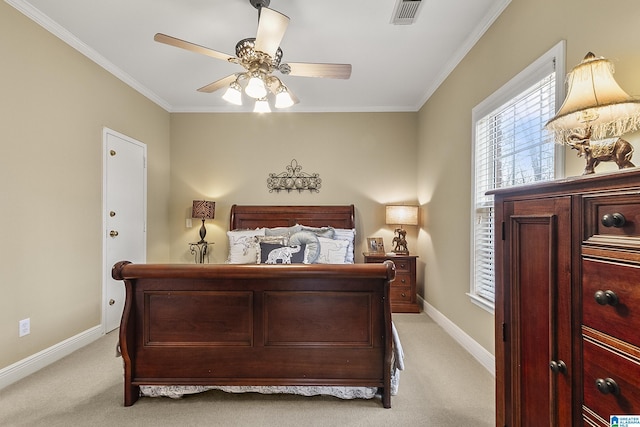 bedroom with crown molding, light colored carpet, and ceiling fan