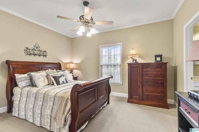 carpeted bedroom featuring crown molding and ceiling fan