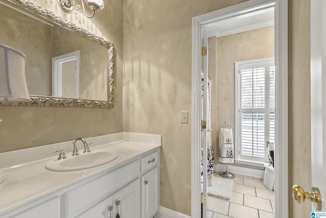 bathroom with vanity and crown molding