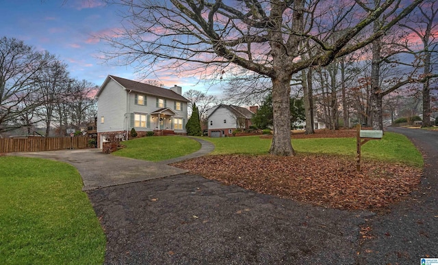 exterior space with driveway and fence