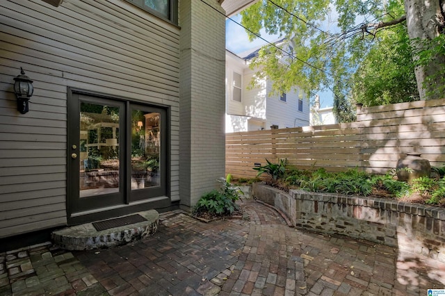 property entrance with a patio area