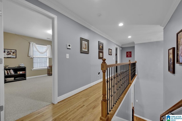 corridor with crown molding and light hardwood / wood-style flooring