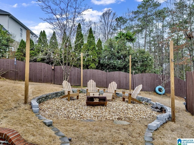 view of yard with an outdoor fire pit