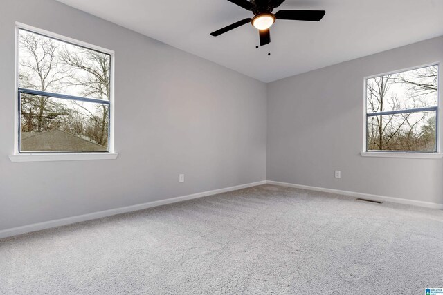 carpeted empty room with ceiling fan