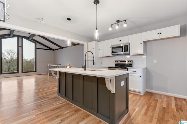 kitchen with white cabinetry, sink, and appliances with stainless steel finishes