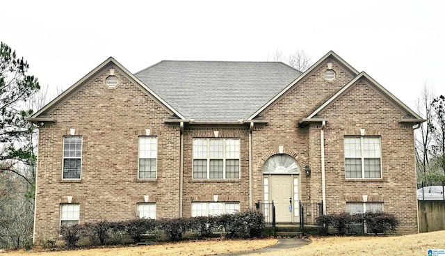 view of front of home featuring brick siding