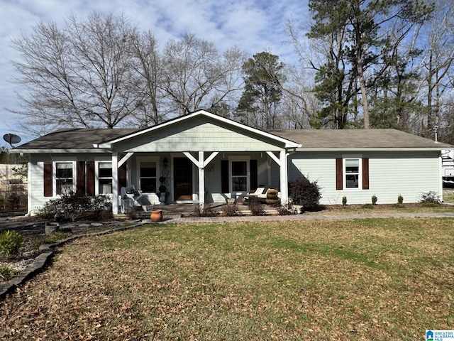 view of front of house featuring covered porch and a front yard