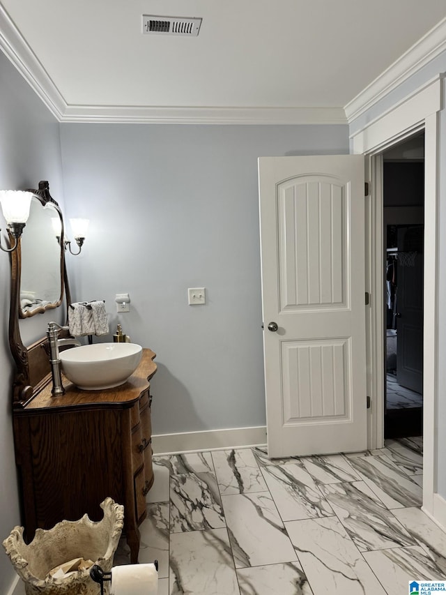 bathroom featuring vanity and ornamental molding