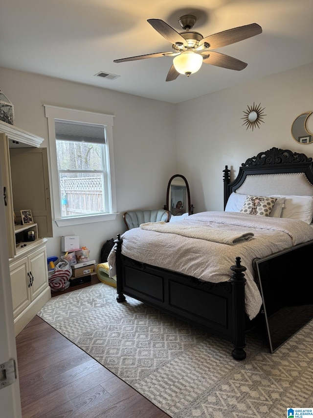 bedroom featuring dark hardwood / wood-style flooring and ceiling fan