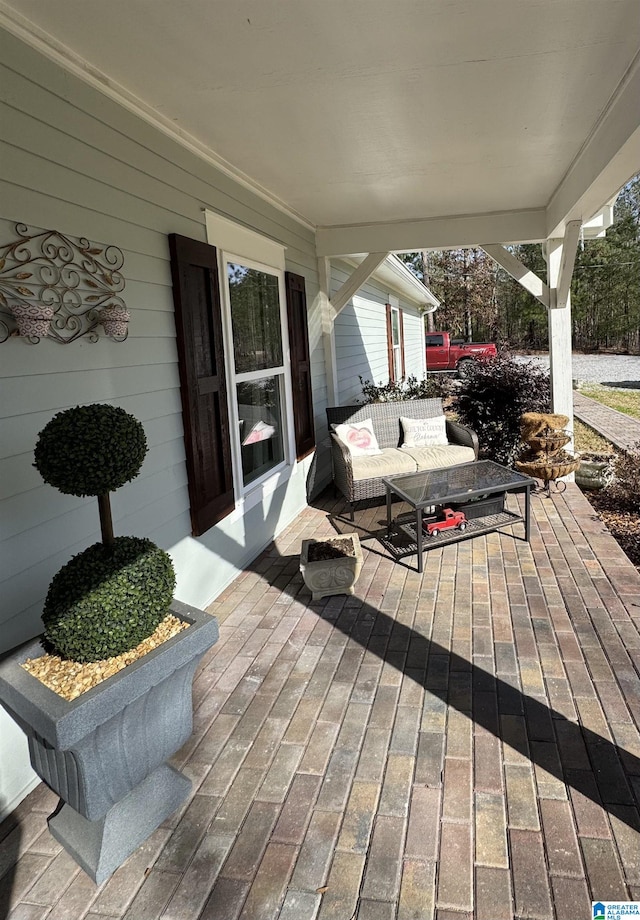 wooden terrace featuring covered porch