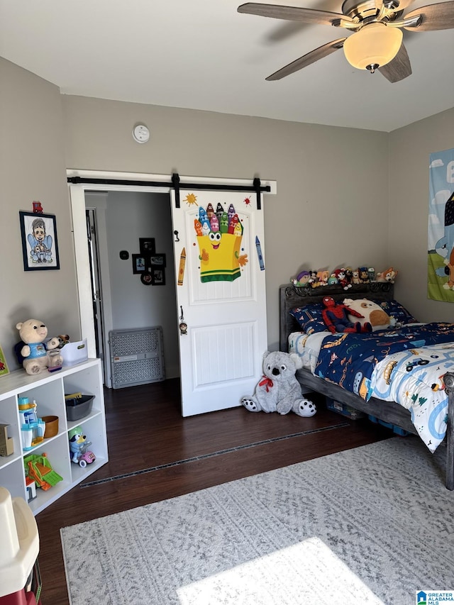 bedroom featuring a ceiling fan and wood finished floors