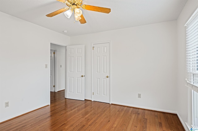 unfurnished bedroom featuring ceiling fan and hardwood / wood-style floors