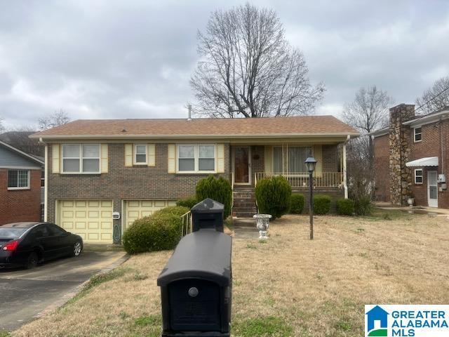 view of front of property with a garage and covered porch