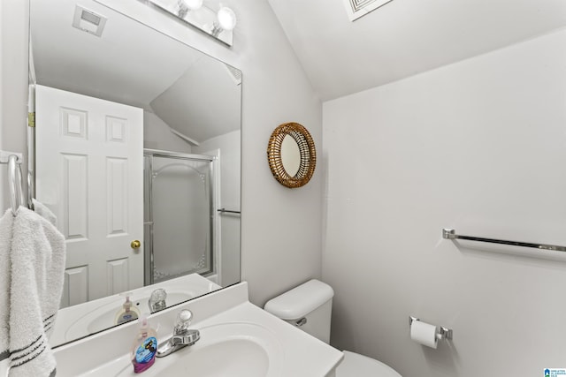 bathroom with a shower with door, vaulted ceiling, sink, and toilet