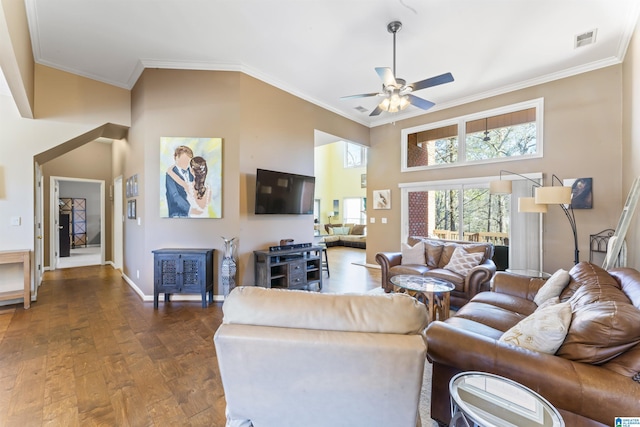 living room with ceiling fan, ornamental molding, dark hardwood / wood-style floors, and a high ceiling