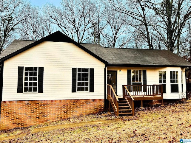 view of front of house featuring a wooden deck