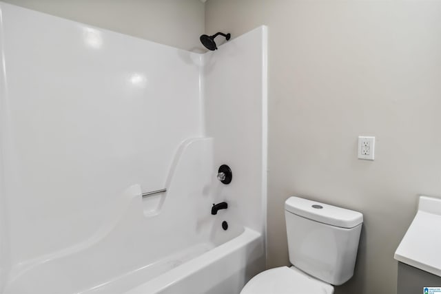 full bathroom featuring vanity, toilet, and washtub / shower combination