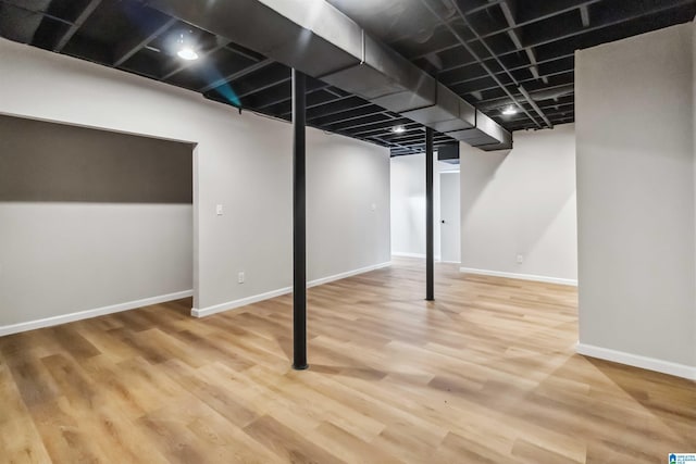 basement featuring hardwood / wood-style flooring