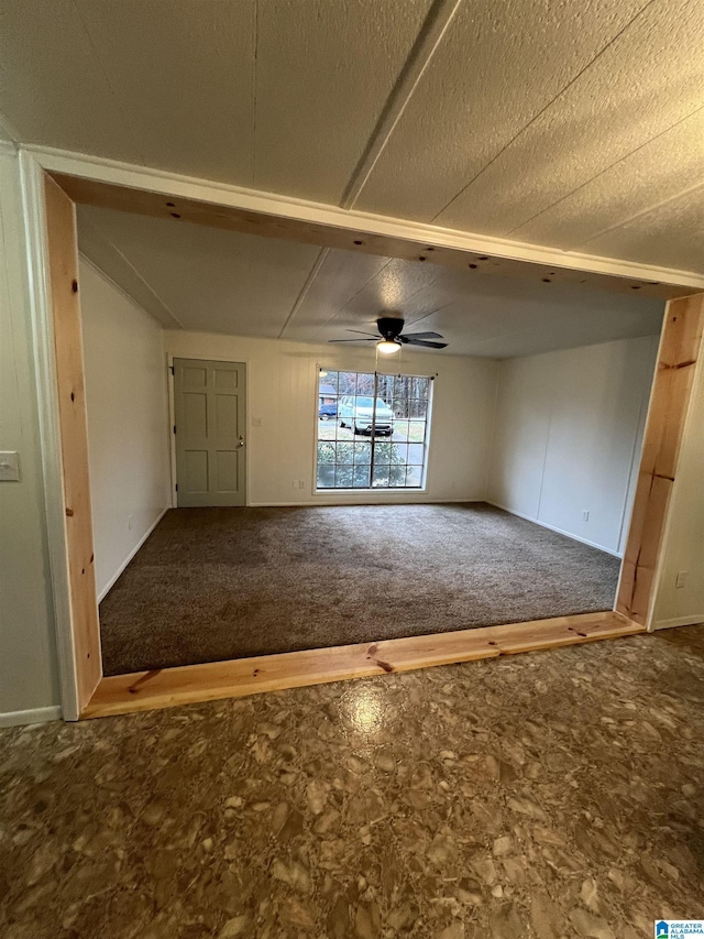 spare room featuring carpet floors and ceiling fan