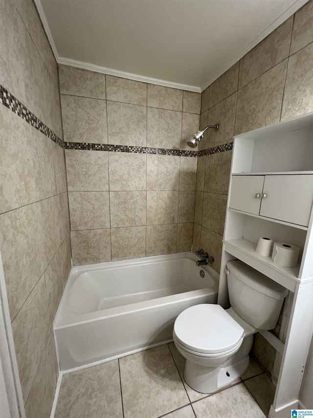 bathroom featuring crown molding, tiled shower / bath, toilet, and tile patterned flooring