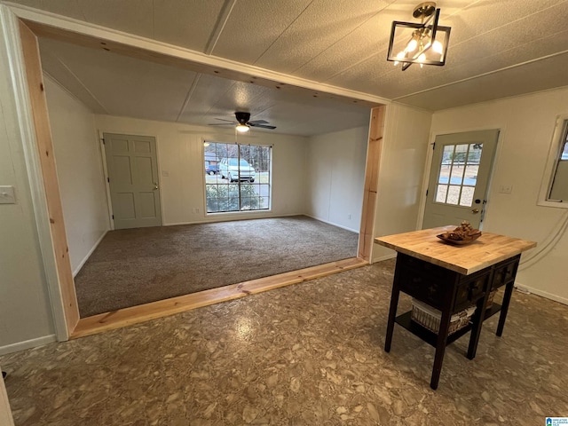 unfurnished dining area with ceiling fan