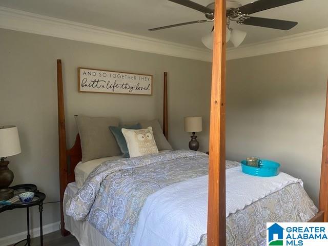 bedroom featuring ceiling fan, ornamental molding, and baseboards