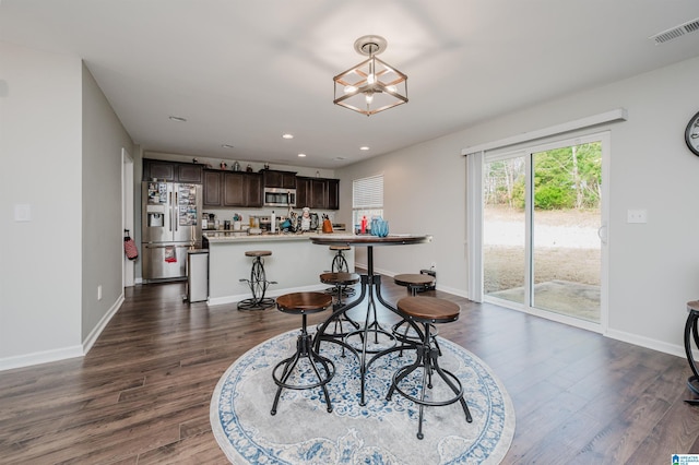 dining area featuring dark hardwood / wood-style flooring