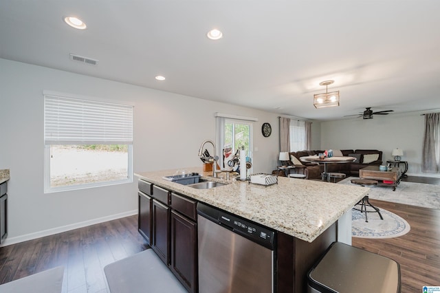 kitchen with sink, a kitchen island with sink, stainless steel dishwasher, and dark hardwood / wood-style flooring